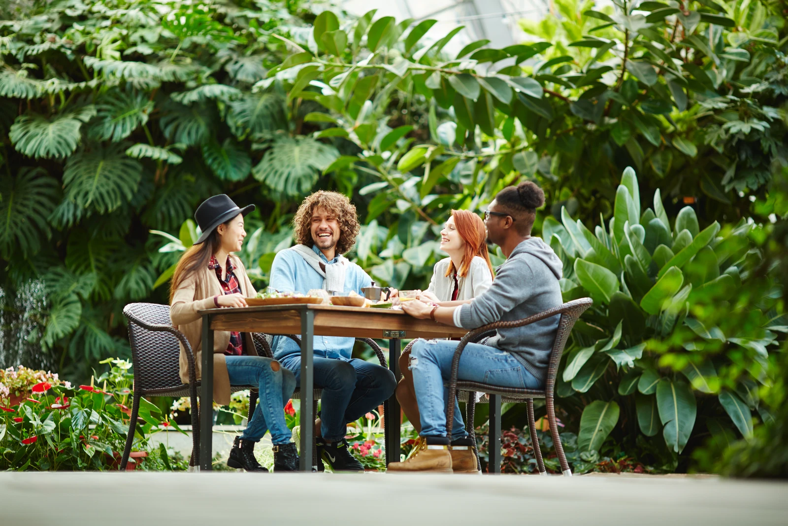 People sharing a conversation in a garden